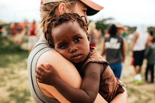 Woman caring for young child